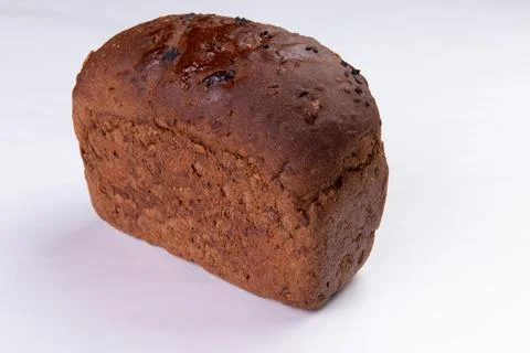 Black bread on a white background. Stock Photos