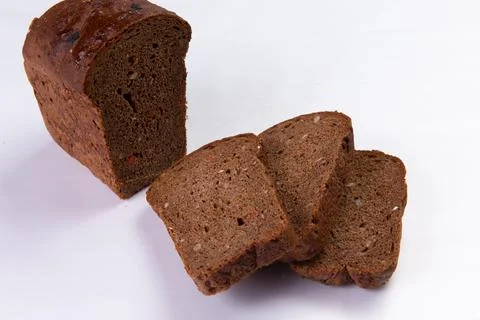 Black bread on a white background. Stock Photos