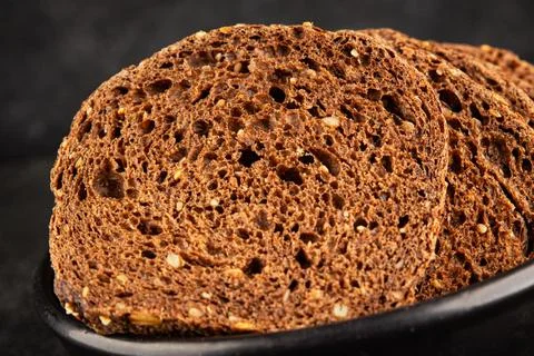 Black bread whole-grain rye flour slices of dark bread healthy eating delic.. 스톡 사진
