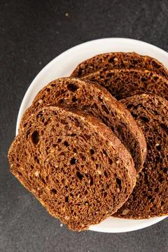 Black bread whole-grain rye flour slices of dark bread healthy eating delic.. Stock Photos