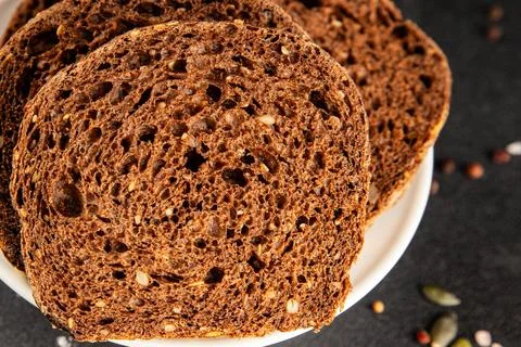 Black bread whole-grain rye flour slices of dark bread healthy eating delic.. Stock Photos