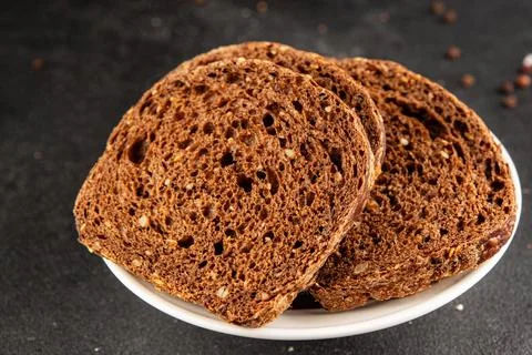 Black bread whole-grain rye flour slices of dark bread healthy eating delic.. Stock Photos