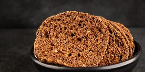 Black bread whole-grain rye flour slices of dark bread healthy eating delic.. Stock Photos
