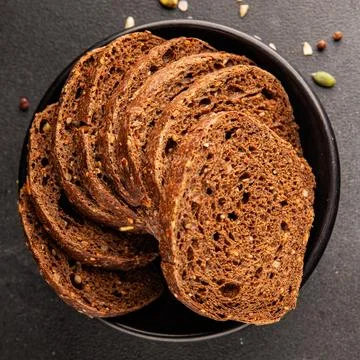 Black bread whole-grain rye flour slices of dark bread healthy eating delic.. Stock Photos