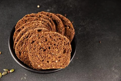Black bread whole-grain rye flour slices of dark bread healthy eating delic.. Stock Photos