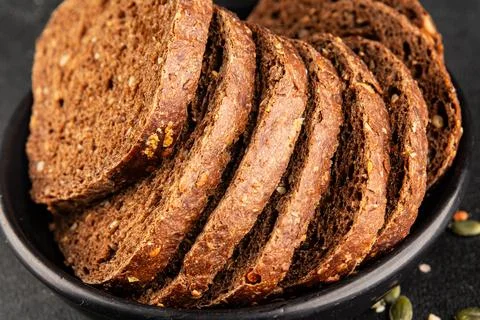 Black bread whole-grain rye flour slices of dark bread healthy eating delic.. Stock Photos
