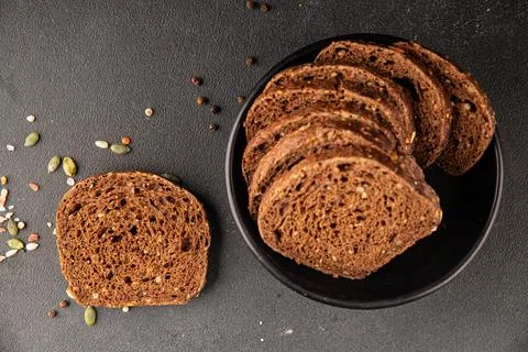 Black bread whole-grain rye flour slices of dark bread healthy eating delic.. Stock Photos