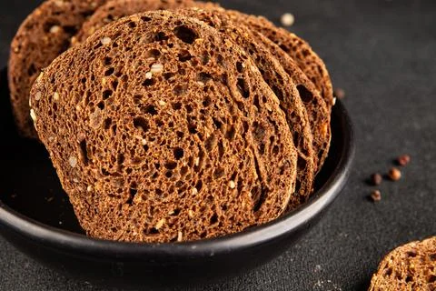 Black bread whole-grain rye flour slices of dark bread healthy eating delic.. Stock Photos