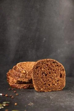 Black bread whole-grain rye flour slices of dark bread healthy eating delic.. Stock Photos