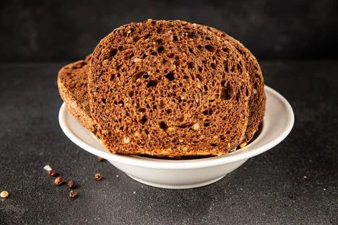 Black bread whole-grain rye flour slices of dark bread healthy eating delic.. Stock Photos
