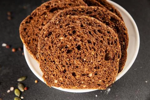 Black bread whole-grain rye flour slices of dark bread healthy eating delic.. Stock Photos