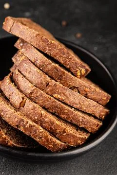 Black bread whole-grain rye flour slices of dark bread healthy eating delic.. Stock Photos