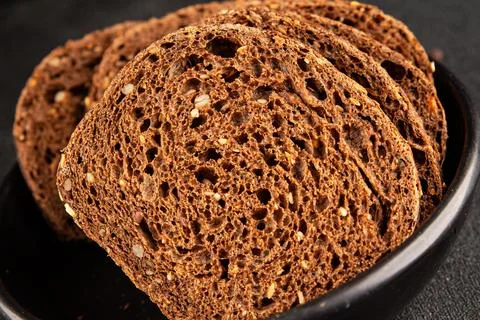 Black bread whole-grain rye flour slices of dark bread healthy eating delic.. Stock Photos