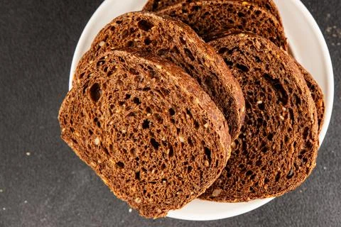 Black bread whole-grain rye flour slices of dark bread healthy eating delic.. Stock Photos