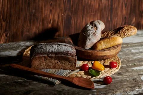 Black bread on wooden table Stock Photos