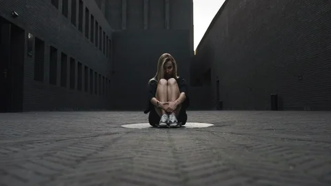 The black brick room with blonde in the frame Stock Footage 123943387