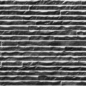 Black brick wall with snow Stock Photos