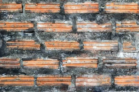 Black-brown wall from bricks for background. Stock Photos