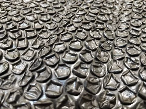 Black bubble wrap packaging material isolated for safe shipping and secure stora Stock Photos