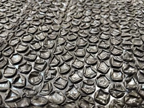 Black bubble wrap packaging material isolated for safe shipping and secure stora Stock Photos
