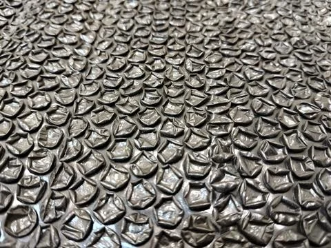 Black bubble wrap packaging material isolated for safe shipping and secure stora Stock Photos