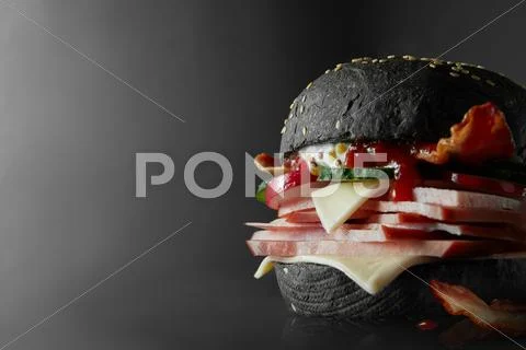 Black Burger with Cheese. Stock Photos