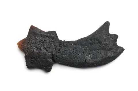 Black burnt biscuit comet shape Stock Photos