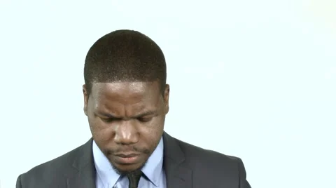 Black businessman looking seriously into the camera (1) Stock Footage 61650693