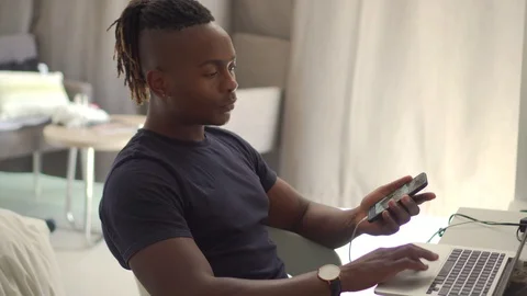 Black Businessman Multi Tasking, Work And Travel With Laptop And Mobile Phone Stock Footage 111970253