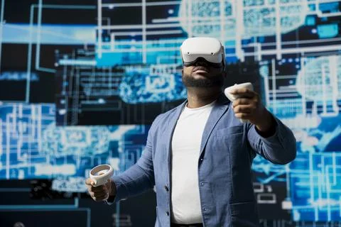 Black businessman using advanced technology VR headset tools Stock Photos