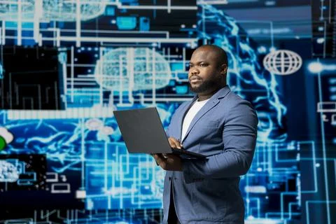 Black businessman using smart technology to interact with cybernetic platforms Stockfoto's