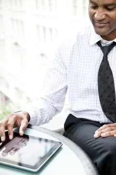 A black businessman working on a notebook computer.. Stock Photos