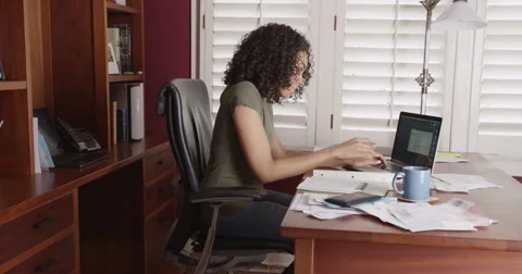 Black businesswoman working from home on laptop Stock Footage