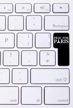 Black button on keyboard with pray for paris sign Stock Photos