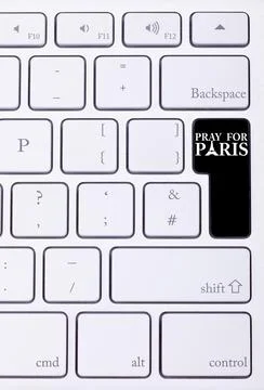 Black button on keyboard with pray for paris sign Stock Photos
