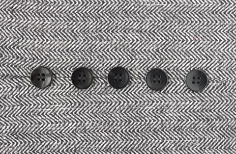 Black Button on Zig Zag Pattern or Triangle Pattern on Center Frame Stock Photos