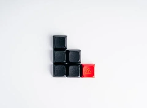 Black buttons forming declining chart with a red warning button. Declining .. Фото