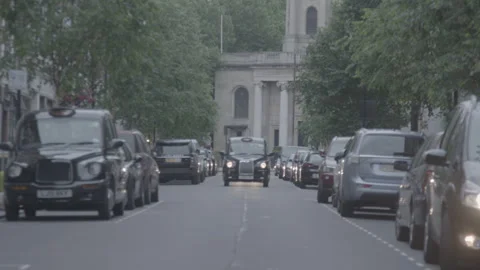 Black cab driving down a street in central London Stock Footage 342565927