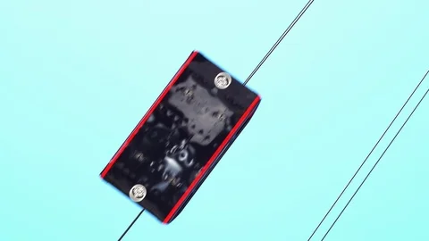 Black Cable Car Passes Directly Overhead on Clear Day Stock Footage 86212269