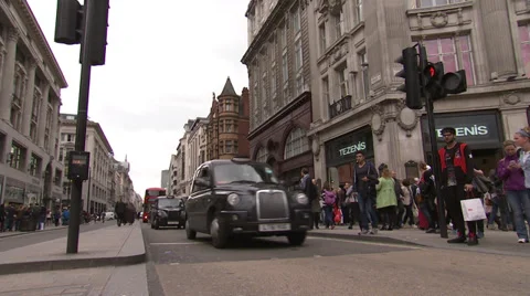 Black cabs and Double Decker bus at intersection Stock Footage 39227947