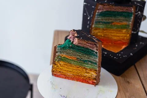 Black Cake Cut with Colored Layers Stock Photos