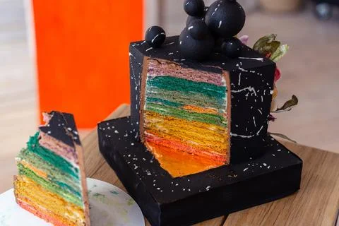 Black Cake Cut with Colored Layers Stock Photos
