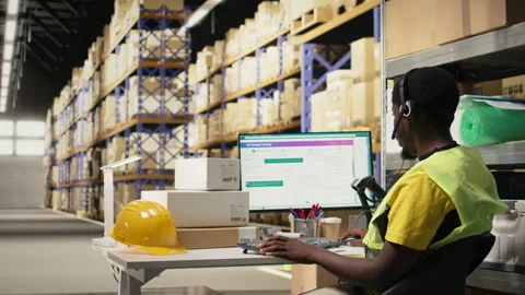 Black call center operator assisting a client with order mix up problems Stock Footage 315716355