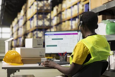 Black call center operator assisting a client with order mix up problems Stock Photos
