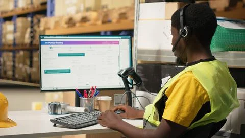 Black call center operator assisting a client with order mix up problems Stock-Fotos