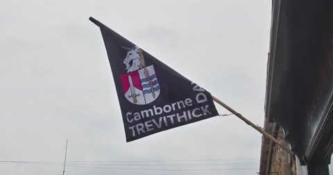Black Camborne Trevithick Flag Against Cloudy Sky In Camborne, Cornwall, Stock Footage 195302003