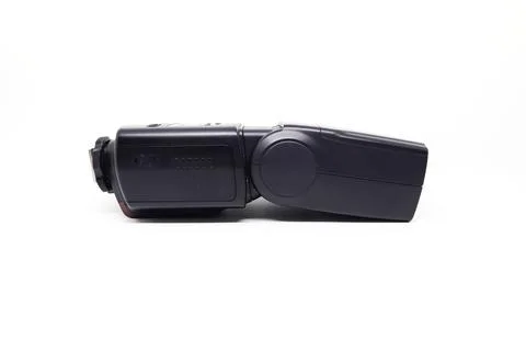 Black camera flash isolated on white background. Focus on the front flash. Stock Photos