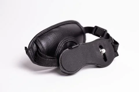 Black camera hand strap made of genuine leather with a metal carabiner for .. Stock Photos