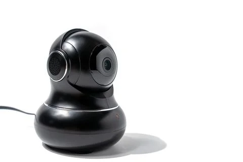 A black camera with a red light on the bottom Stock Photos