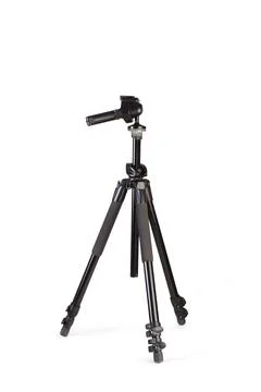 A black camera tripod on a white background with copy space Stock Photos
